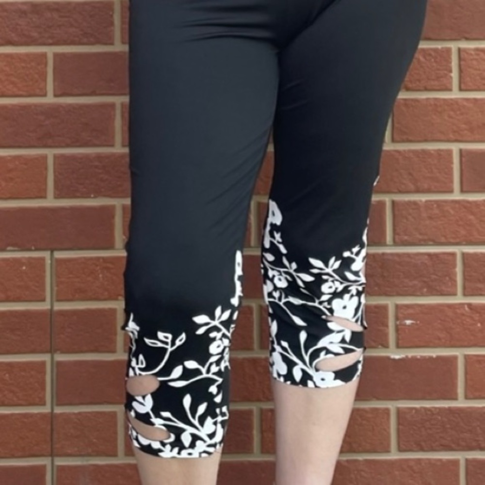 WORN ONCE! SUPER CUTE CAPRI PANTS WITH FLORAL HEM AND HOLE ACCENTS! - Picture 3 of 9